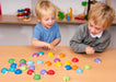 Children playing with wooden Sorting Lady birds