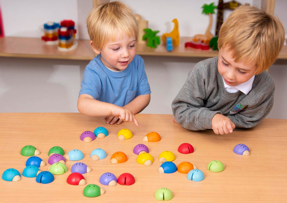 Children playing with wooden Sorting Lady birds