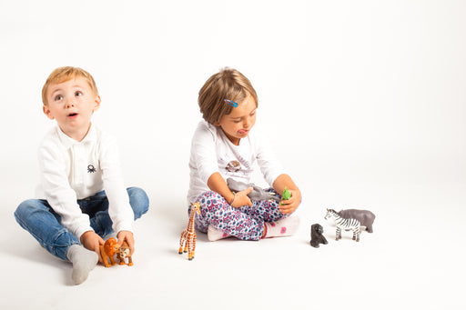 Children playing with wild animals toys