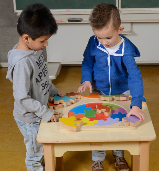 Boys playing with jigsaw puzzle