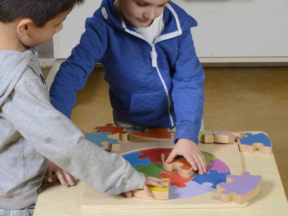 Children playing with jigsaw puzzle